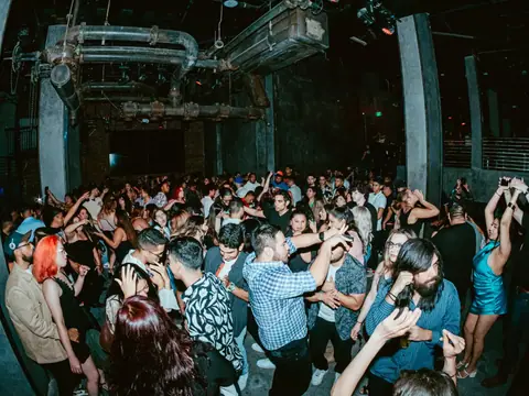 Packed dance floor with hands in the air under the lights at The Catwalk Club, Downtown LA (Sat 25 June)