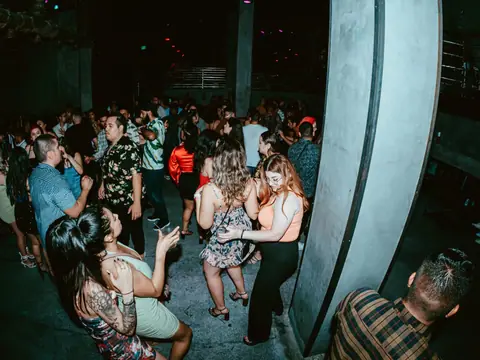 Packed dance floor with hands in the air under the lights at The Catwalk Club, Downtown LA (Sat 25 June)