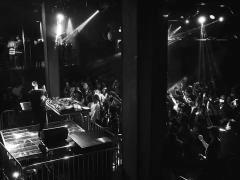 DJ performing in the booth above the crowd at The Catwalk Club, Downtown LA (Sat 18 June)
