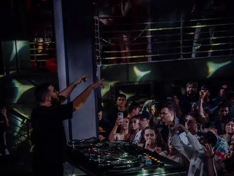 DJ performing in the booth above the crowd at The Catwalk Club, Downtown LA (Sat 18 June)
