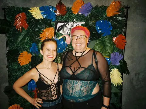 Guests in front of a floral photo backdrop at a themed night at The Catwalk Club (Sat 11 June)