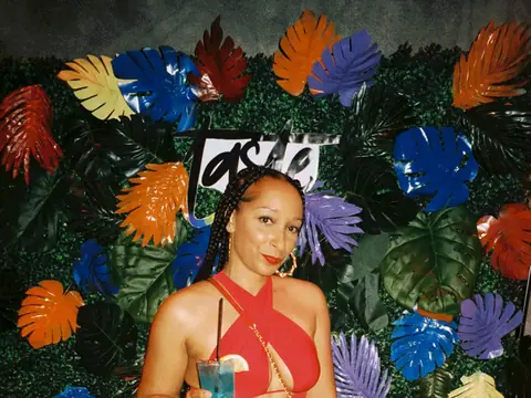 Guests in front of a floral photo backdrop at a themed night at The Catwalk Club (Sat 11 June)